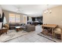 Open concept living and dining area with hardwood floors at 6301 Beavertail Pond Ave, Las Vegas, NV 89122