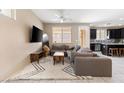 Spacious living room with sectional sofa and kitchen views at 6301 Beavertail Pond Ave, Las Vegas, NV 89122