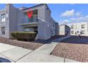 Building exterior showcasing a designated unit with a balcony at 6800 E Lake Mead Blvd # 2028, Las Vegas, NV 89156