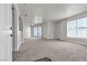 Spacious living room with carpet flooring and access to a balcony at 6800 E Lake Mead Blvd # 2028, Las Vegas, NV 89156
