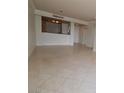 Bright living room features neutral paint, and sleek tile flooring plus a bar area at 270 E Flamingo Rd # 211, Las Vegas, NV 89169