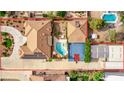 Expansive aerial view showcasing a luxurious home with a pool, basketball court, and landscaped backyard at 2730 El Camino Rd, Las Vegas, NV 89146