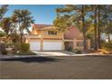 Two-story house with a three-car garage at 2917 Chapala Dr, Las Vegas, NV 89120