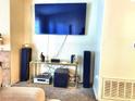Living room with large TV, stereo system, and seating at 3318 N Decatur Blvd # 2068, Las Vegas, NV 89130