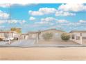 Single-story house with a landscaped yard and driveway at 6215 Newville Ave, Las Vegas, NV 89103