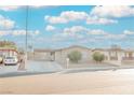 Single-story house with a landscaped yard and driveway at 6215 Newville Ave, Las Vegas, NV 89103