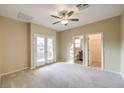 Bright bedroom with balcony access and carpet at 7642 Riva Ridge St, Las Vegas, NV 89149