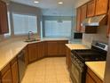 Kitchen with modern appliances and corner sink at 1628 Rio Bravo Dr, North Las Vegas, NV 89031