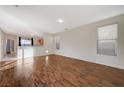 Spacious living area featuring hardwood floors and an open layout at 8856 Ashley Park Ave, Las Vegas, NV 89148