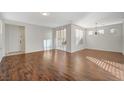 Open concept living room with hardwood floors and access to backyard at 8856 Ashley Park Ave, Las Vegas, NV 89148
