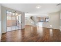 Bright living room with hardwood floors and sliding glass doors at 8856 Ashley Park Ave, Las Vegas, NV 89148