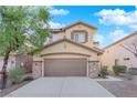 Two-story house with a brown garage door and stone accents at 9161 Horizon Mist Ave, Las Vegas, NV 89178
