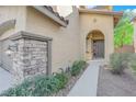 Inviting front entrance with stonework and landscaping at 9161 Horizon Mist Ave, Las Vegas, NV 89178