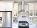 Modern kitchen with stainless steel appliances and white cabinets at 9701 Ann Arbor Ln, Las Vegas, NV 89134