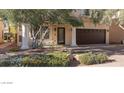 Front view of two story house with landscaping at 11017 Ladyburn Ct, Las Vegas, NV 89141