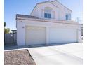 Two-story house with a two-car garage and gravel landscaping at 1429 Daybreak Dr, Las Vegas, NV 89108