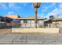 House exterior with a palm tree, block wall, and street view at 1641 Stewart Ave, Las Vegas, NV 89101