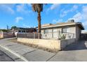 House exterior with a palm tree and a block wall at 1641 Stewart Ave, Las Vegas, NV 89101