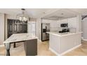 Kitchen features marble countertops and stainless steel appliances at 1901 Summit Pointe Dr, Las Vegas, NV 89117