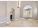 Bright living room with large windows and tile floors at 1901 Summit Pointe Dr, Las Vegas, NV 89117