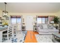 Bright living room features hardwood floors and neutral colored furniture at 2050 N Los Feliz St # 172, Las Vegas, NV 89156