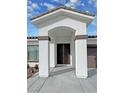 Elegant entryway with double doors and arched alcove at 2560 Tahachapi Ave, Pahrump, NV 89048