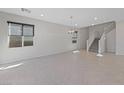 Spacious dining room with tile floors and a chandelier at 2720 High Echelon Rd, North Las Vegas, NV 89086