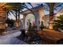 Inviting entryway with red door, a wooden deck, and a zen garden at 274 Doobie Ave, Las Vegas, NV 89183