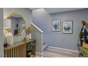 Bright entryway with console table, mirror, and stairs at 2844 Copper Wind Ln # 4, Las Vegas, NV 89183