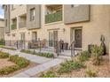 Private patio with seating area and wrought-iron fence at 2844 Copper Wind Ln # 4, Las Vegas, NV 89183