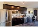 Dark wood cabinets and granite countertops at 29 Montelago Blvd # 317, Henderson, NV 89011