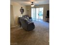 Relaxing living room with comfy seating and sliding door access at 3550 Bay Sands Dr # 2062, Laughlin, NV 89029