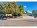 House exterior showcasing a tree and front yard at 4850 Aveneda Grande, Las Vegas, NV 89121