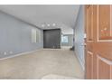 Spacious living room with neutral walls and carpet at 6513 Heavenly Moon St, North Las Vegas, NV 89084