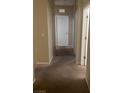 Carpeted hallway with neutral walls leading to several doors at 658 Forest Peak St, Henderson, NV 89011