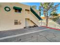 View of condo building's entrance and parking area at 6750 Del Rey Ave # 262, Las Vegas, NV 89146