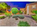 Landscaped front yard with desert plants and gravel accents at 70 Portezza Dr, Henderson, NV 89011