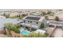 Two-story house with pool and solar panels at 7306 Puckershire St, Las Vegas, NV 89166