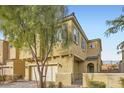 Two-story home with brick-paved driveway, private entrance, and desert landscaping at 8031 Tank Loop St, Las Vegas, NV 89166