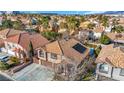 Two-story house with solar panels, three-car garage, and inviting pool at 8220 Fawn Heather Ct, Las Vegas, NV 89149