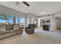 Open-concept living room flowing into the kitchen, featuring neutral tones and a comfortable seating area at 840 Picotte St # 101, Las Vegas, NV 89144