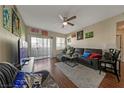 Living room with gray sectional sofa and wood floors at 8777 W Maule Ave # 1094, Las Vegas, NV 89148