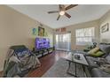 Living room with gray sectional sofa and wood floors at 8777 W Maule Ave # 1094, Las Vegas, NV 89148