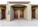 Two brown doors with an arched entryway and light colored walls at 9000 Las Vegas Blvd # 2243, Las Vegas, NV 89123