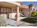 Inviting front patio with wrought iron gate and comfortable seating area at 9520 Yucca Blossom Dr, Las Vegas, NV 89134