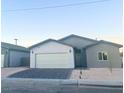 New single-story home with gray and white exterior and a two-car garage at 1308 E Nelson Ave, North Las Vegas, NV 89030