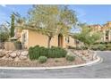 Charming one-story home with stucco exterior, stone accents, and mature landscaping at 4 Via Centrale # 1, Henderson, NV 89011