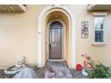 Attractive front door with brick walkway and landscaping at 4 Via Centrale # 1, Henderson, NV 89011