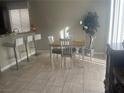 Bright dining area with a four-person table and chairs, near the kitchen at 4029 Grant Hill Ave, North Las Vegas, NV 89081