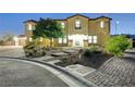 Two-story house with landscaped yard and driveway at night at 4807 Enchanted View St, Las Vegas, NV 89149